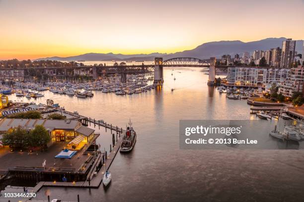 burrard bridge at sunset time - granville stock pictures, royalty-free photos & images