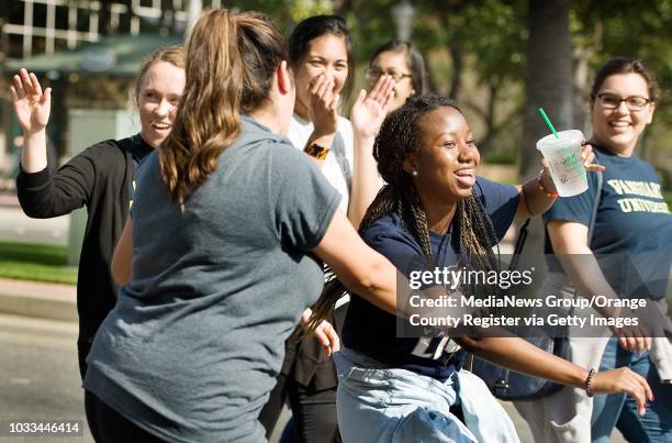 Students from Vanguard University, a private college in Costa Mesa, dance along to music during the Black History Parade & Cultural Faire on Saturday...