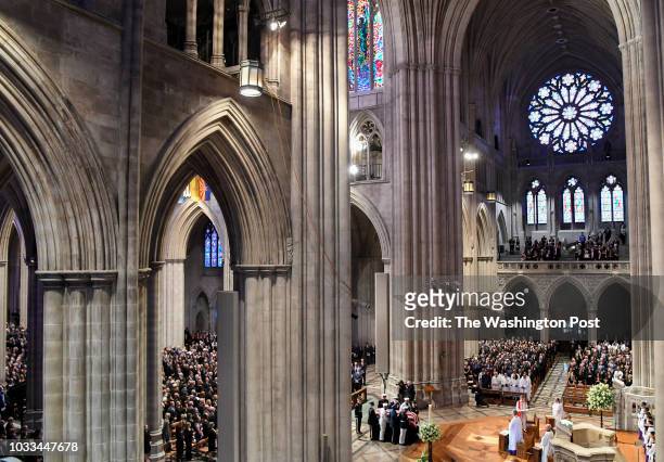 The Honor Guard carries in the casket at the start of the funeral service at the National Cathedral for Sen. John S. McCain , a six-term senator from...