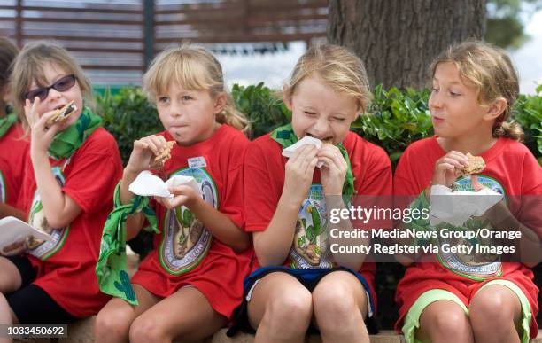 Girl Scouts take time out to celebrate National S'mores Day by eating the warm, gooey creation sandwhiched between Girl Scout cookies. They were at...