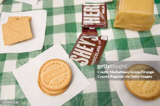 The Girl Scout version of s'mores includes their cookies, Traditional, Thanks-A-Lot, or Lemonades, with melted marshmallows and chocolate inbetween....