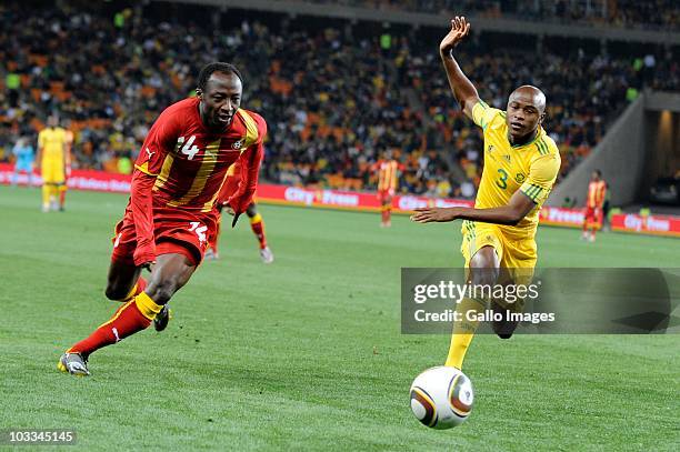 Draman Haminu and Tsepo Masilela during the International Friendly match between South Africa and Ghana at Soccer City Stadium on August 11, 2010 in...