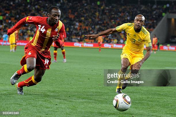 Draman Haminu and Tsepo Masilela during the International Friendly match between South Africa and Ghana at Soccer City Stadium on August 11, 2010 in...