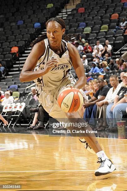 Chamique Holdsclaw of the San Antonio Silver Stars moves the ball moves the ball against the Minnesota Lynx during a WNBA game at the AT&T Center on...