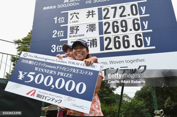 Third place Momoka Miura and first place Lala Anai of Japan celebrate during the presentation of longest drive contest after the second round of the...