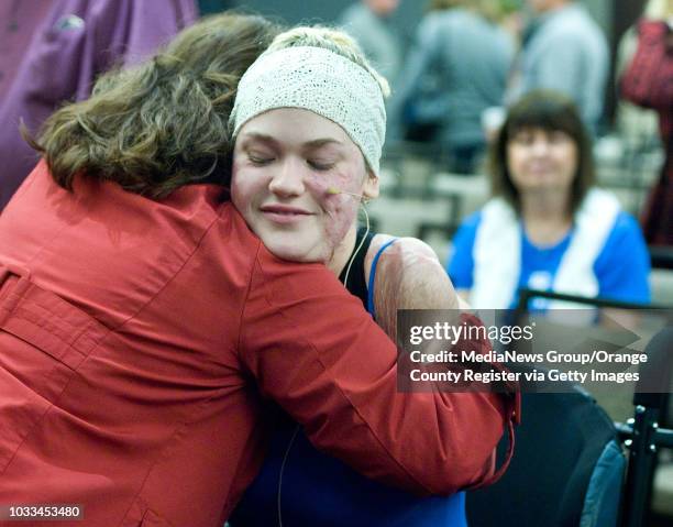 Kaitlyn Dobrow gets a warm reception after talking about her physical and spiritual journey to members of the River Church of OC on Sunday. Doctors...