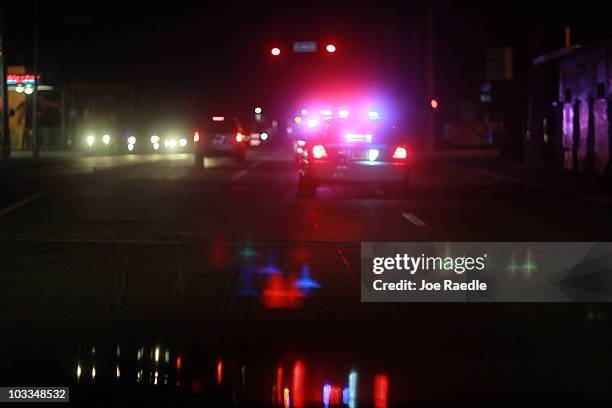 City of Miami police car with lights ablaze responds to a call as they patrol the street on August 11, 2010 in Miami, Florida. The Miami Police...