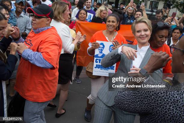 Cynthia Nixon and Zephyr Teachout dance with supporters at a get out the vote rally on September 8, 2018 in the Williamsburg neighborhood of Brooklyn...