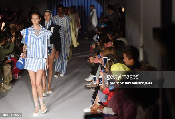 Models walk the runway at the Xiao Li Show during London Fashion Week September 2018 at The BFC Show Space on September 14, 2018 in London, England.