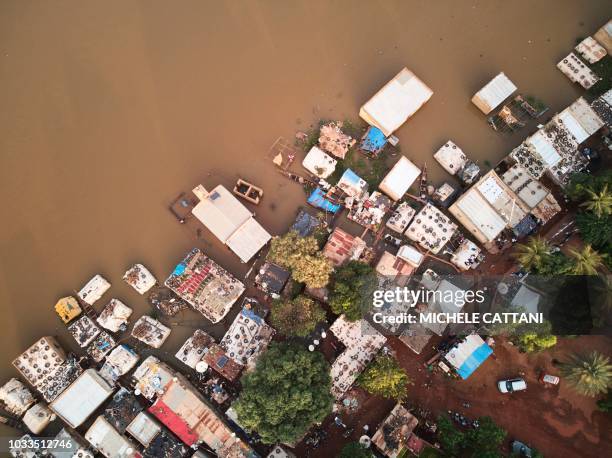 An aerial view shows a part of the Bozo village, on the outskirts of the Malian capital Bamako, flooded by Niger's waters following heavy rain, on...