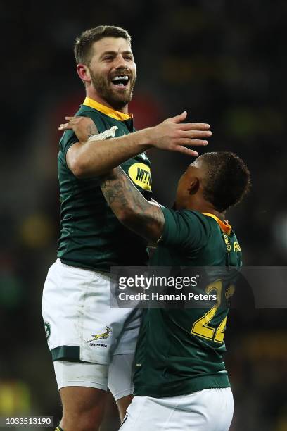 Willie le Roux of South Africa celebrates with Elton Jantjies after winning The Rugby Championship match between the New Zealand All Blacks and the...