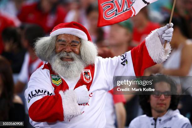 Dragons supporter cheers during the NRL Semi Final match between the South Sydney Rabbitohs and the St George Illawarra Dragons at ANZ Stadium on...