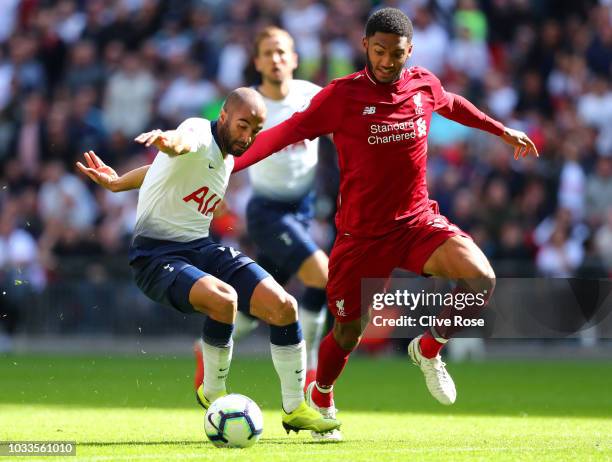 Lucas Moura of Tottenham Hotspur is challenged by Joe Gomez of Liverpool during the Premier League match between Tottenham Hotspur and Liverpool FC...