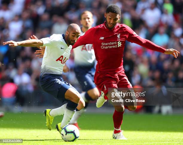 Lucas Moura of Tottenham Hotspur and Joe Gomez of Liverpool battle for the ball during the Premier League match between Tottenham Hotspur and...