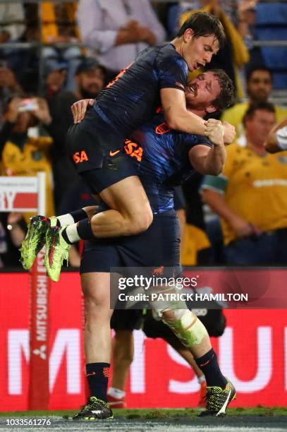 Argentina's Gonzalo Bertranou embraces Julian Montoya after their victory during the Rugby Championship match between Australia and Argentina on the...