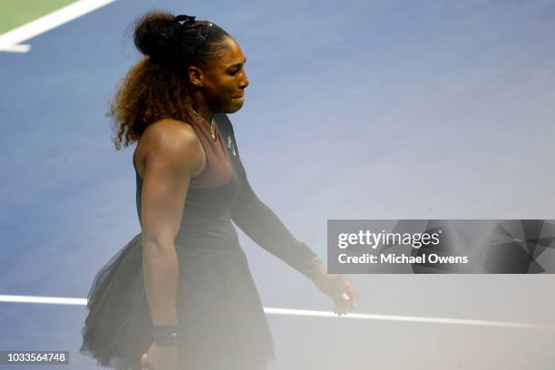 Serena Williams of the United States reacts after arguing with grand slam supervisor Donna Kelso and referee Brian Earley during her Women's Singles...