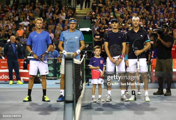 Sanjar Fayziev and Denis Istomin of Uzbekistan pose for a photo along side Jamie Murray and Dominic Inglot during day two of the Davis Cup by BNP...