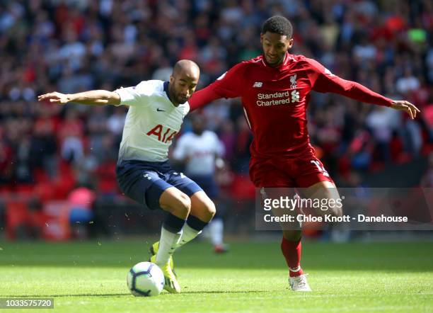 Lucas Moura of Tottenham Hotspur and Joe Gomez of Liverpool in action during the Premier League match between Tottenham Hotspur and Liverpool FC at...