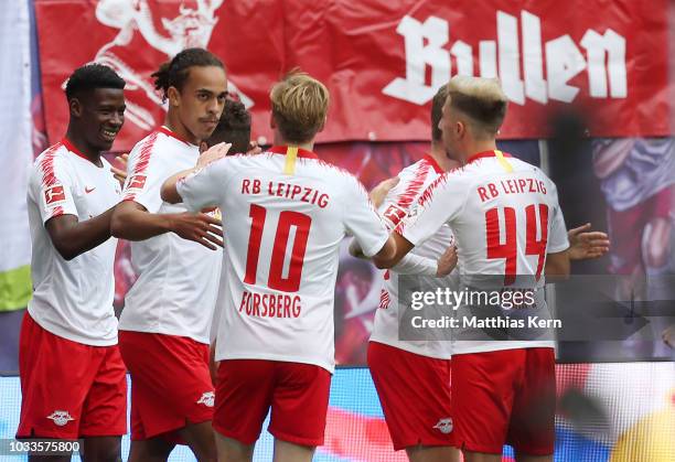 Yussuf Poulsen of Leipzig jubilates with team mates after scoring the first goal during the Bundesliga match between RB Leipzig and Hannover 96 at...