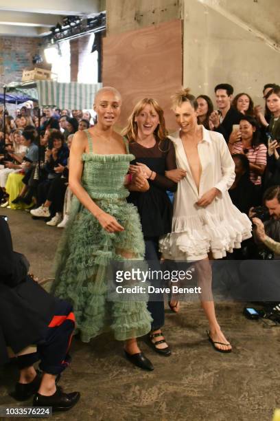 Adwoa Aboah, Molly Goddard and Edie Campbell are seen on the runway at the Molly Goddard front row during London Fashion Week September 2018 on...