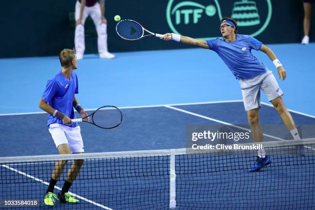 Denis Istomin of Uzbekistan stretches to play forehand during day two of the Davis Cup by BNP Paribas World Group Play off match between Great...