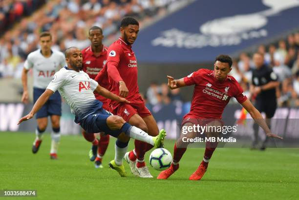 Tottenham Hotspur's Lucas Moura battles for possession with Liverpool's Joe Gomez and Trent Alexander-Arnold during the Premier League match between...