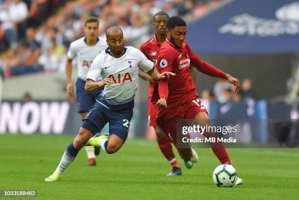 Tottenham Hotspur's Lucas Moura battles for possession with Liverpool's Joe Gomez during the Premier League match between Tottenham Hotspur and...