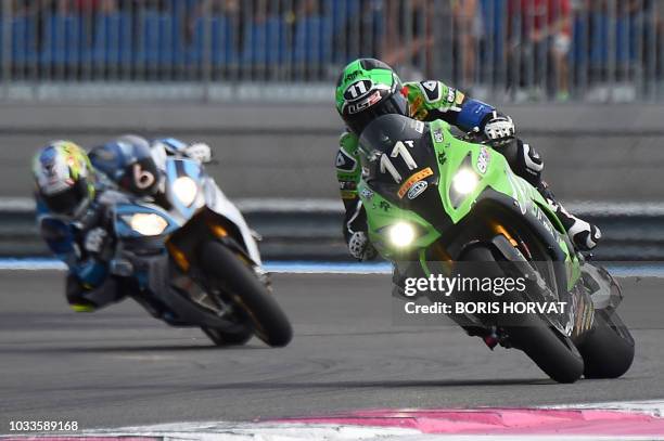 French rider Randy De Puniet on Kawasaki ZX-10R leads the pack after the start of the 82nd Bol d'Or 24-hour motorbike endurance race, at the...