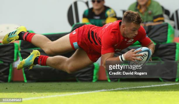 Alex Lewington of Saracens dives over for a try during the Gallagher Premiership Rugby match between Northampton Saints and Saracens at Franklin's...