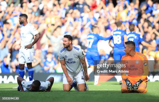 Cardiff City players react following Eden Hazard of Chelsea scoring his side's second goal during the Premier League match between Chelsea FC and...