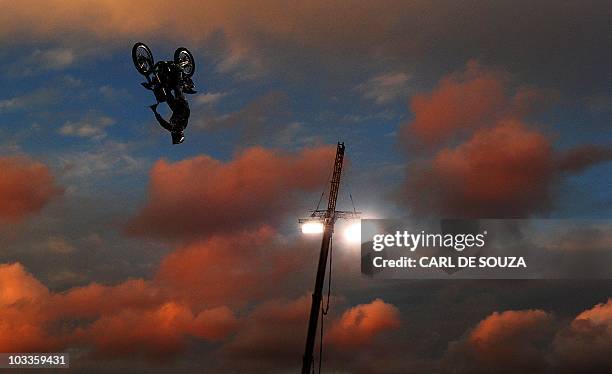 Competitor takes part in a practice session of the Red Bull X-Fighters motocross championships in the grounds of British landmark, Battersea Power...