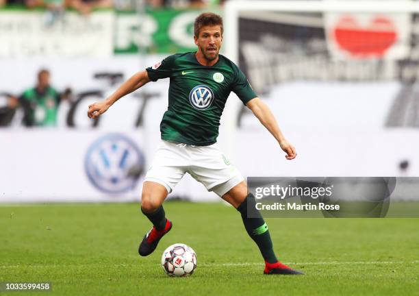 Ignacio Camacho of VfL Wolfsburg runs with the ball during the Bundesliga match between VfL Wolfsburg and Hertha BSC at Volkswagen Arena on September...