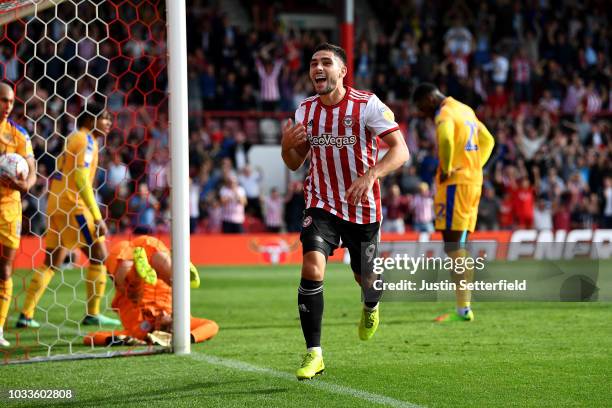 Neal Maupay of Brentford celebrates scoring the 2nd brentford during the Sky Bet Championship match between Brentford and Wigan on September 15, 2018...