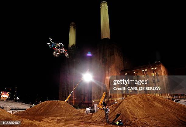 Competitor takes part in a practice session of the Red Bull X-Fighters motocross championships in front of British landmark, Battersea Power Station,...