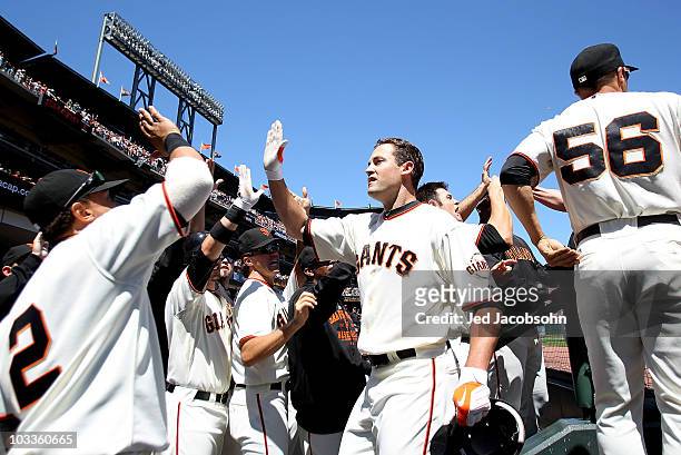 Pat Burrell of the San Francisco Giants celebrates after hitting a grand slam against the Chicago Cubs in the fifth inning during an MLB game at AT&T...