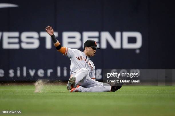 Gorkys Hernandez of the San Francisco Giants dives to catch a fly ball in the eighth inning against the Milwaukee Brewers at Miller Park on September...