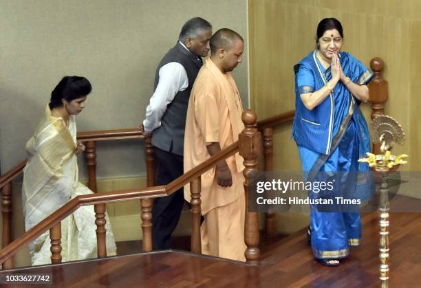 External Affairs Minister Sushma Swaraj and Uttar Pradesh CM Yogi Adityanath, Minister of State for NRI, Flood Control, Agriculture Export,...