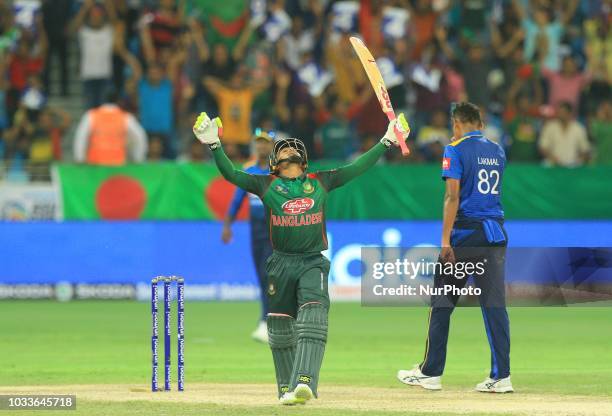 Bangaldesh cricketer Mushfiqur Rahim celebrates his 100 runs during the first cricket match of Asia Cup 2018 between Sri Lanka and Bangladesh in...