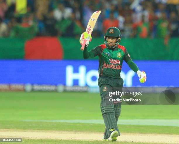 Bangaldesh cricketer Mushfiqur Rahim celebrates his 100 runs during the first cricket match of Asia Cup 2018 between Sri Lanka and Bangladesh in...