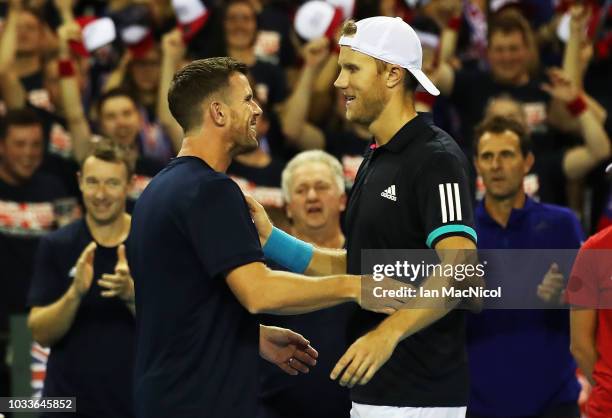Great Britain team captain Leon Smith is seen after Jamie Murray and Dominic Inglot of Great Britain claim victory during the doubles match between...