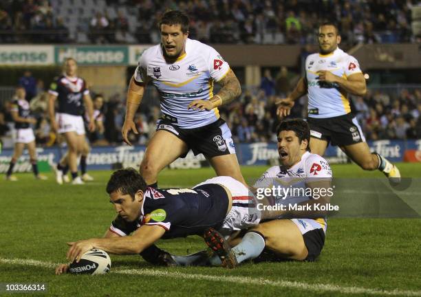 Braith Anasta of the Roosters dives over to score a try during the round 23 NRL match between the Cronulla Sharks and the Sydney Roosters at Toyota...
