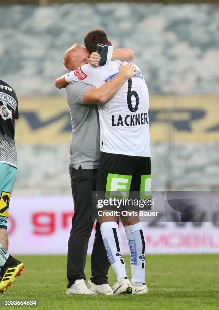 Head coach Heiko Vogel and Markus Lackner of Sturm Graz celebrate victory after the tipico Bundesliga match between FC Admira Wacker and SK Sturm...