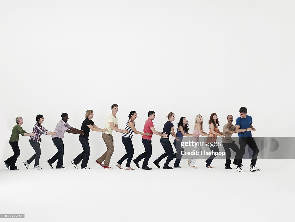 Group of people dancing in a line