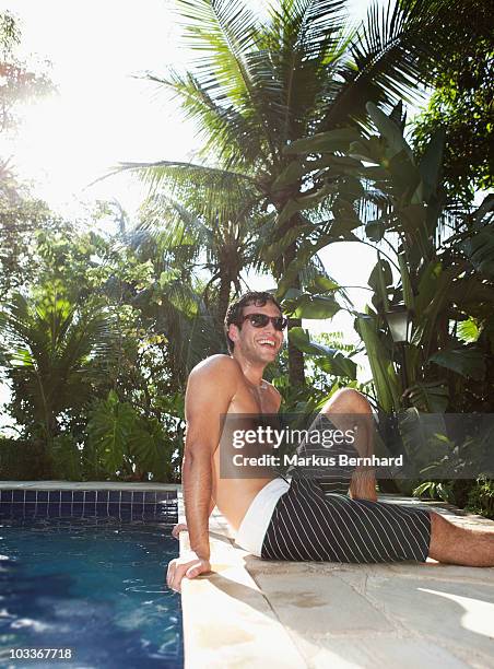 confident young man relaxing at pool. - 60161 imagens e fotografias de stock