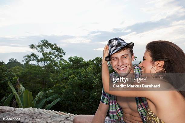 playful couple having fun on a rooftop terrace. - 60161 imagens e fotografias de stock