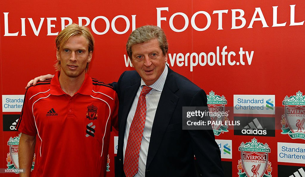 Liverpool soccer manager Roy Hodgson (R)