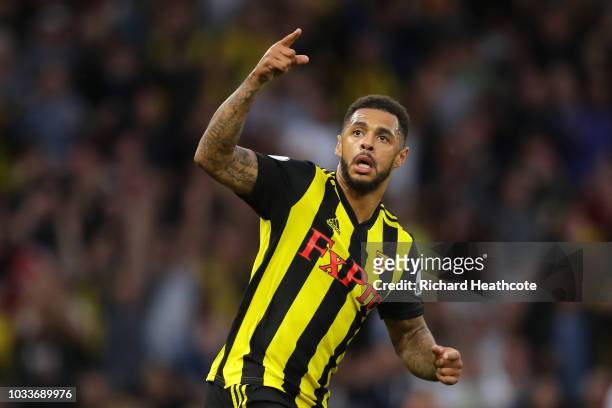 Andre Gray of Watford celebrates after scoring his team's first goal during the Premier League match between Watford FC and Manchester United at...