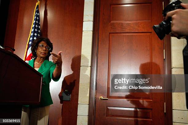 Rep. Maxine Waters asks photographers to move away from her during a news conference she called to challenge the charges made against her by the...
