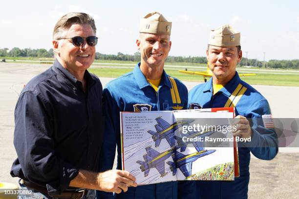 Actor Treat Williams poses with Blue Angels pilots, Lt. C.J. Simonsen and Cdr. Greg McWherter at the Gary Jet Center in Gary, Indiana on AUG 12, 2010.