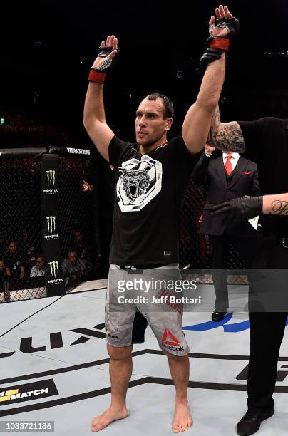 Alexey Kunchenko of Russia celebrates his victory over Thiago Alves of Brazil in their welterweight bout during the UFC Fight Night event at...